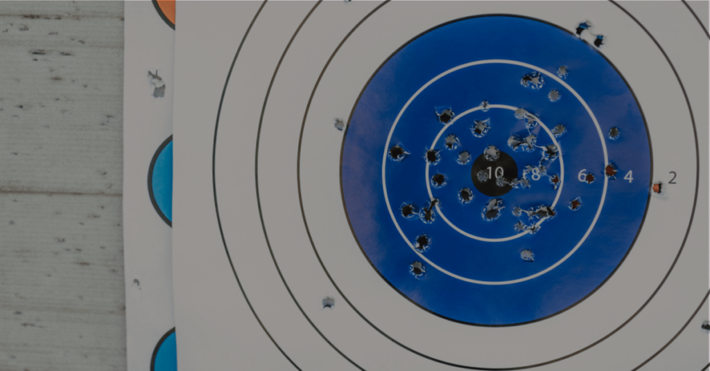 A shooting target with bullet holes near the center