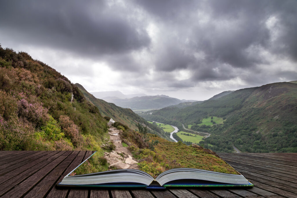 Beautiful landscape from Precipice Walk in Snowdonia overlooking Barmouth and Coed-y-Brenin forest coming out of pages in magical story book. 
